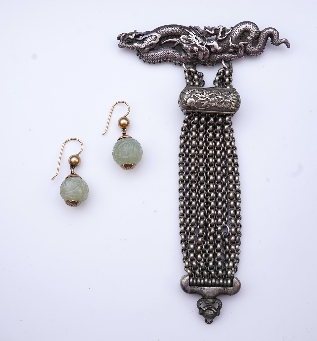 A chatelaine and a pair of serpentine bead earrings